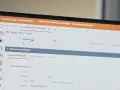 Ekran komputera z interfejsem systemu Merit ERP, widoczne zlecenie produkcyjne z danymi podstawowymi.