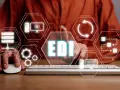 Elektroniczna wymiana danych (EDI) w praktyce: ikony symbolizujące serwery, procesy, dane i technologię.